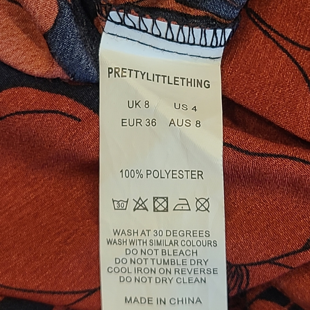 PrettyLittleThing Navy Rust Red Tropical Floral Print Flared Wide Leg Pants 4 - Picture 12 of 13